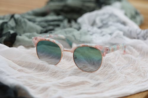 Sunglasses on White Cloth 