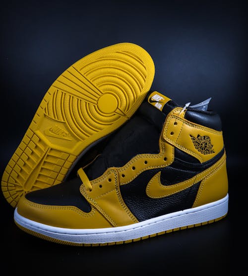 Free A Yellow and Black Nike Shoes Stock Photo