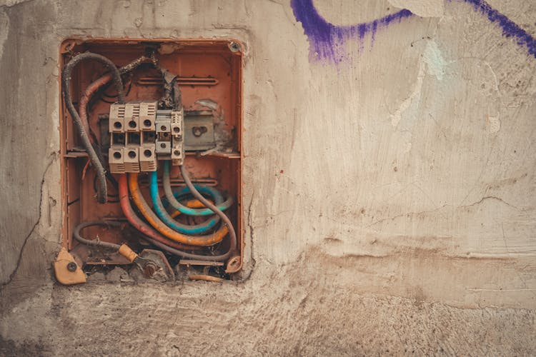 Open Abandoned Electric Box On Wall