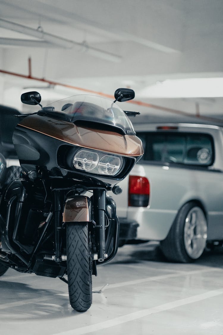 Motorbike And Car Parked In The Garage