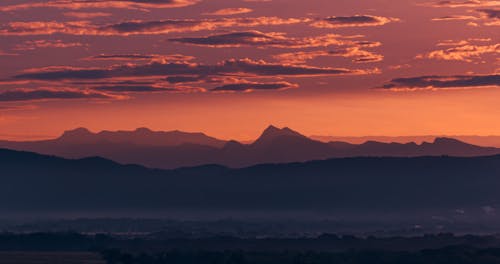 Silhouette of Mountains During Sunrise