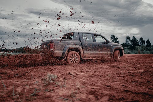 A Moving Car on a Dirt Road