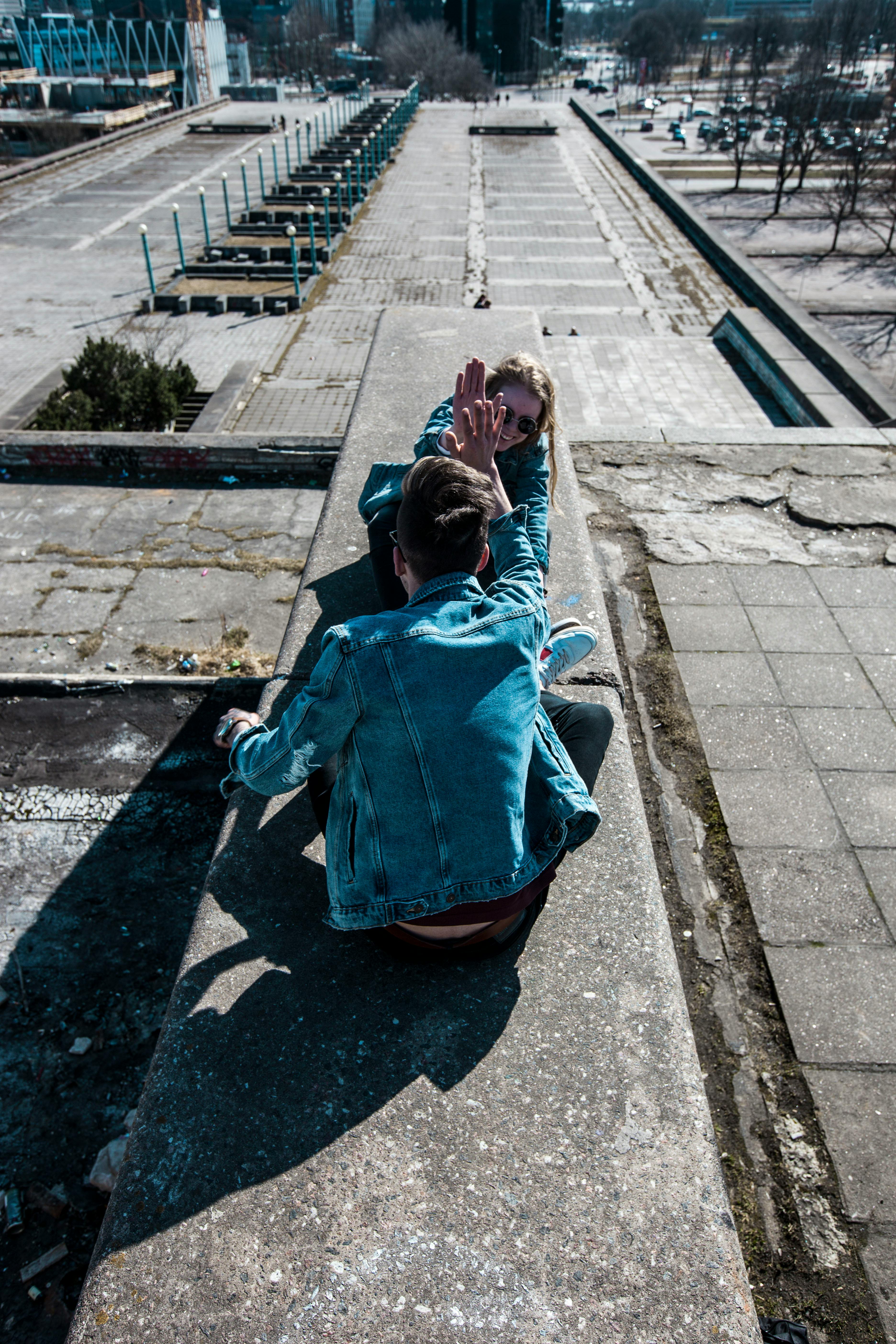 sitting man wearing blue chambray jacket