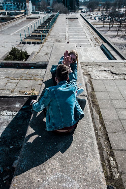 Free Sitting Man Wearing Blue Chambray Jacket Stock Photo