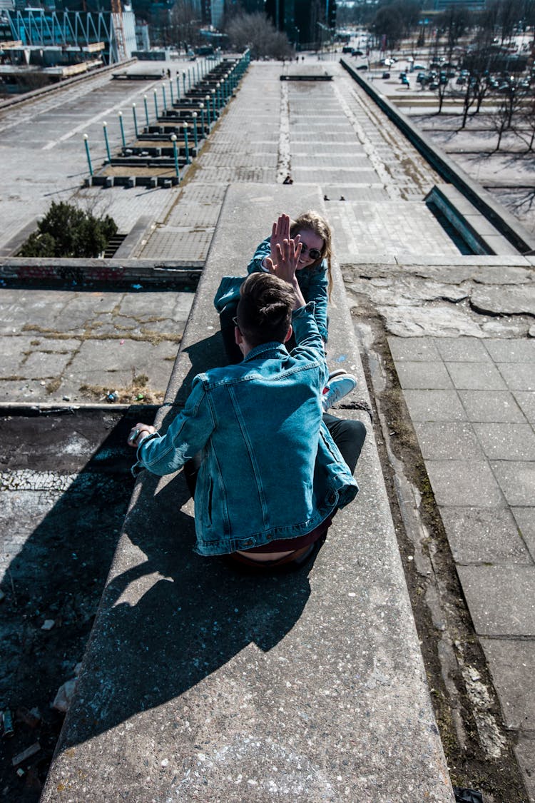 Sitting Man Wearing Blue Chambray Jacket