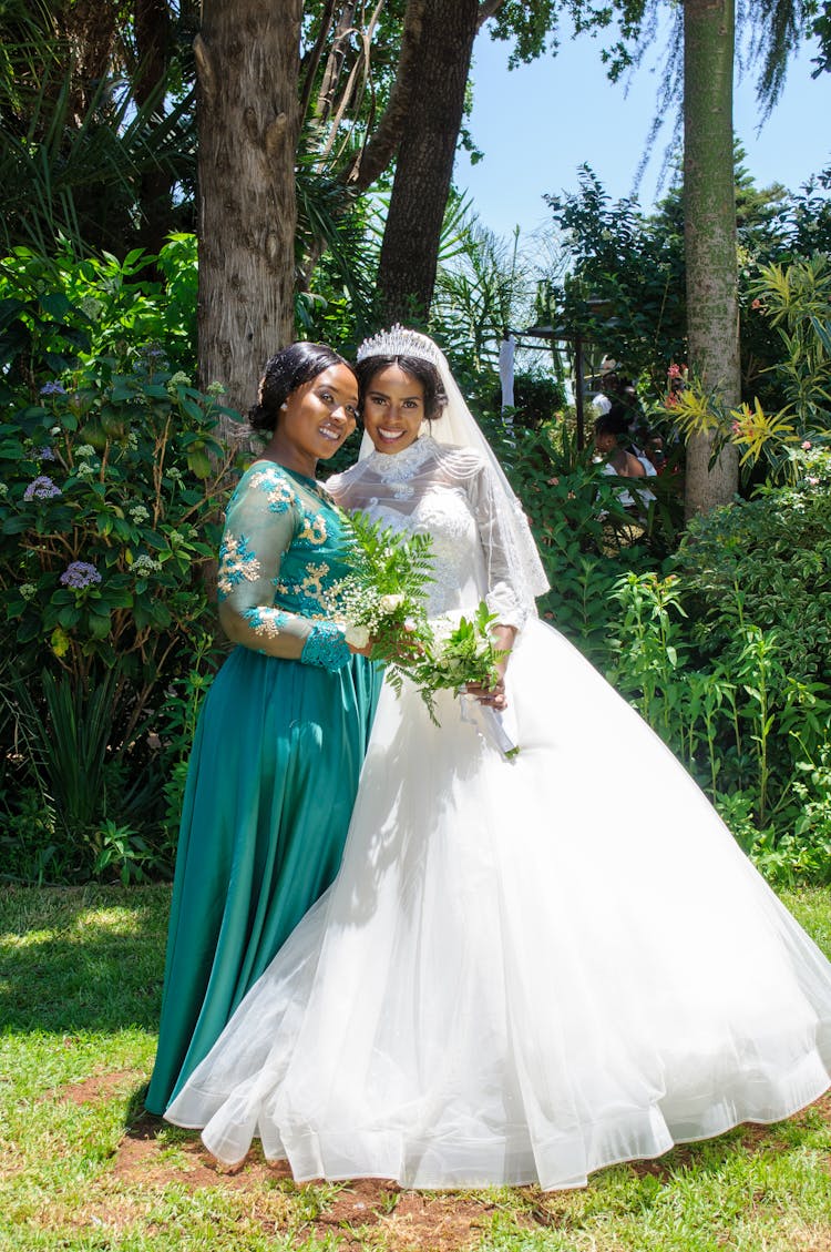 Photo Of A Bride With Bridesmaid Wearing A Turquoise Dress