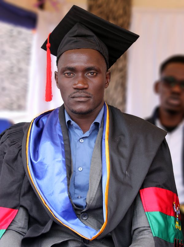 A confident young man celebrating an academic milestone