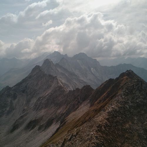Cloud-wrapped mountain ridge, by eberhard grossgasteiger on Pexels