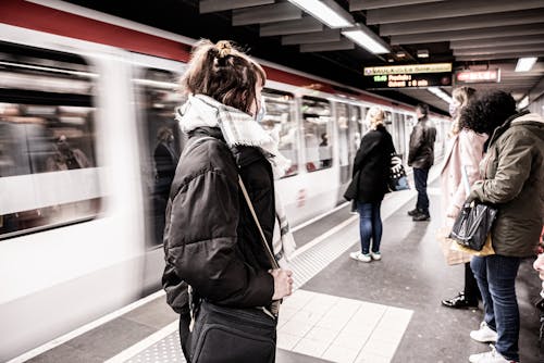 People Standing on Subway Platform