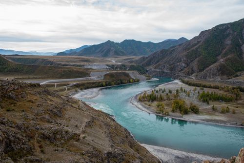 Free A breathtaking view of the winding river and mountains in Altai, Russia, capturing nature's serene beauty. Stock Photo