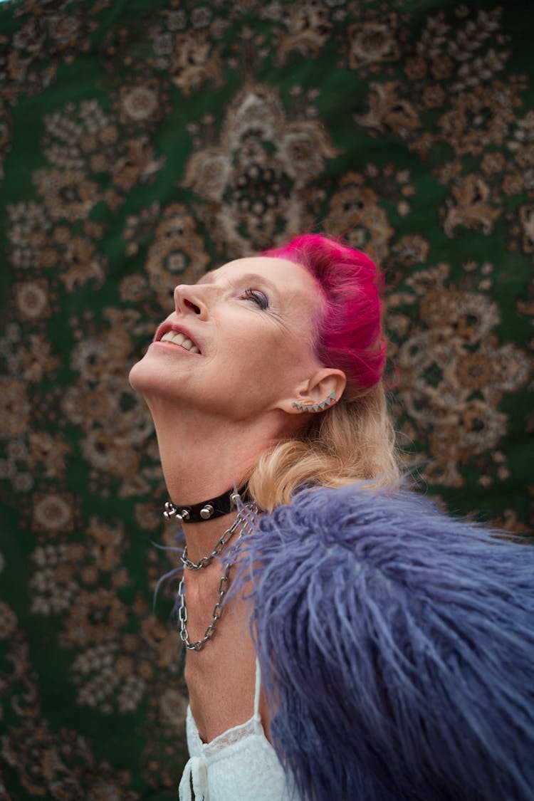 Woman With Pink Hair Posing On The Background Of A Rug