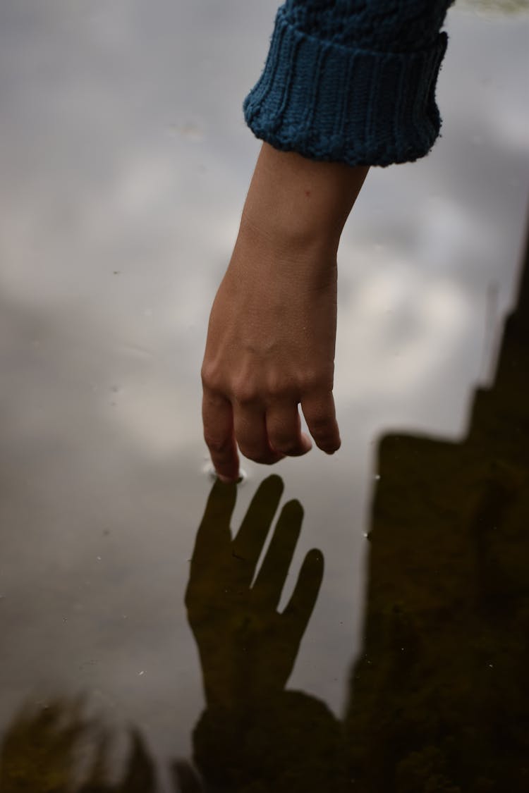 Hand Touching Water 