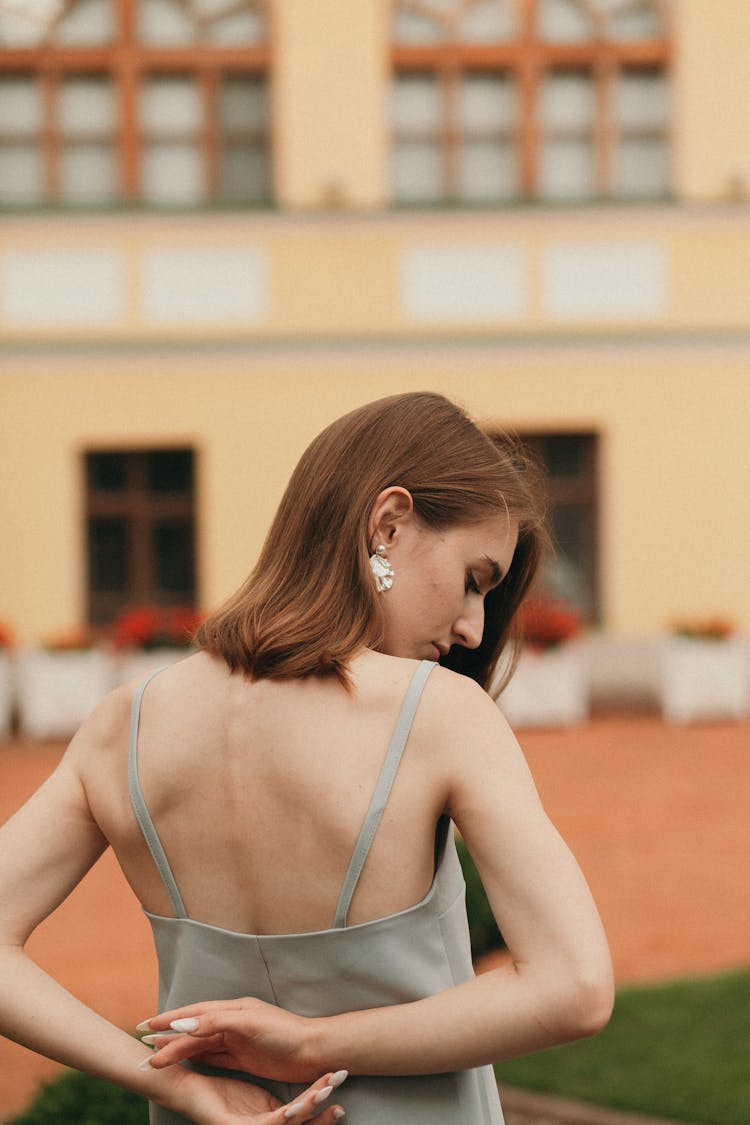 Woman In Low Cut Dress From Behind