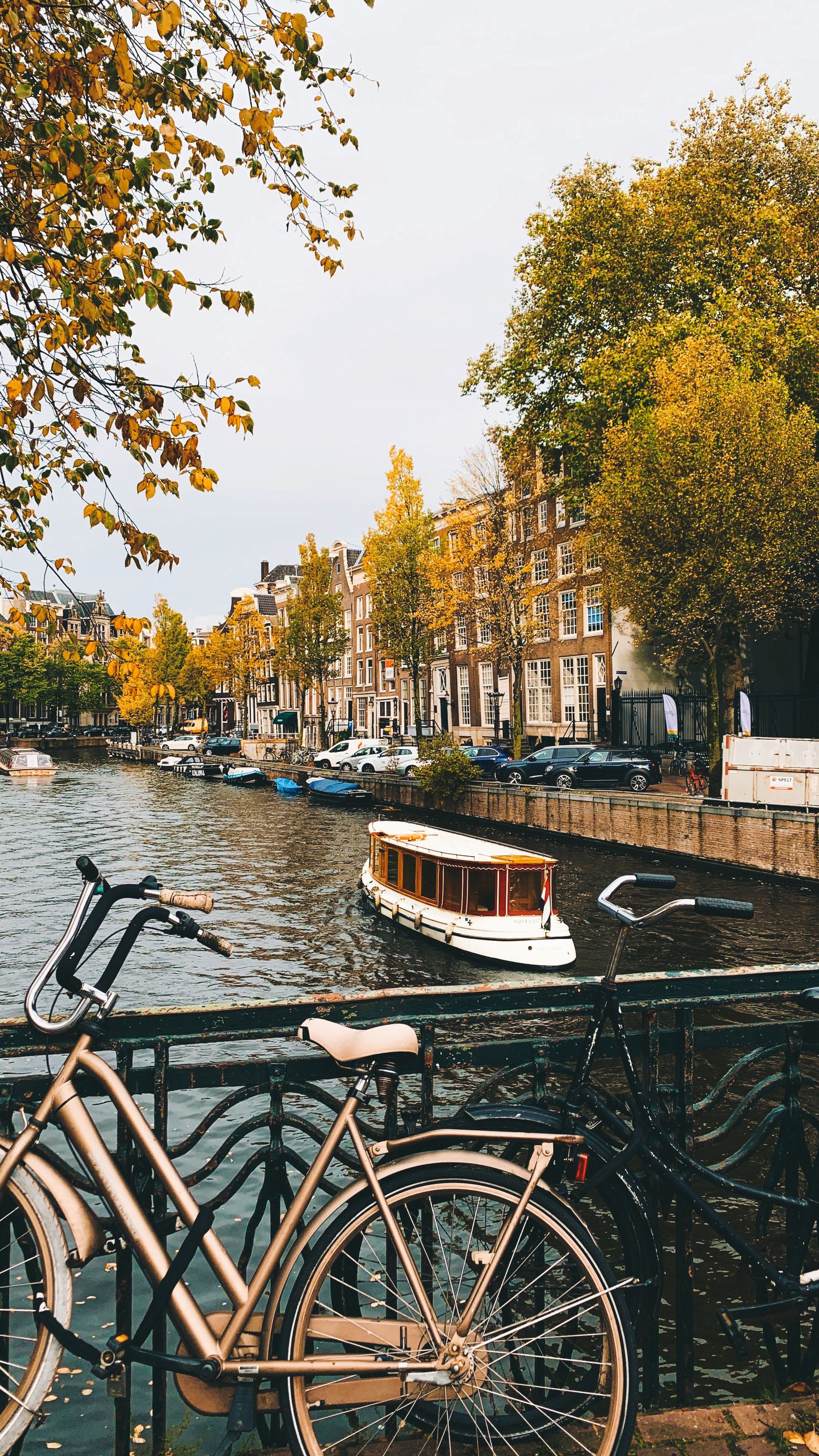 E-Bike Accessories Netherlands 2026 — bicycles parked along an Amsterdam canal, the heart of Dutch cycling culture