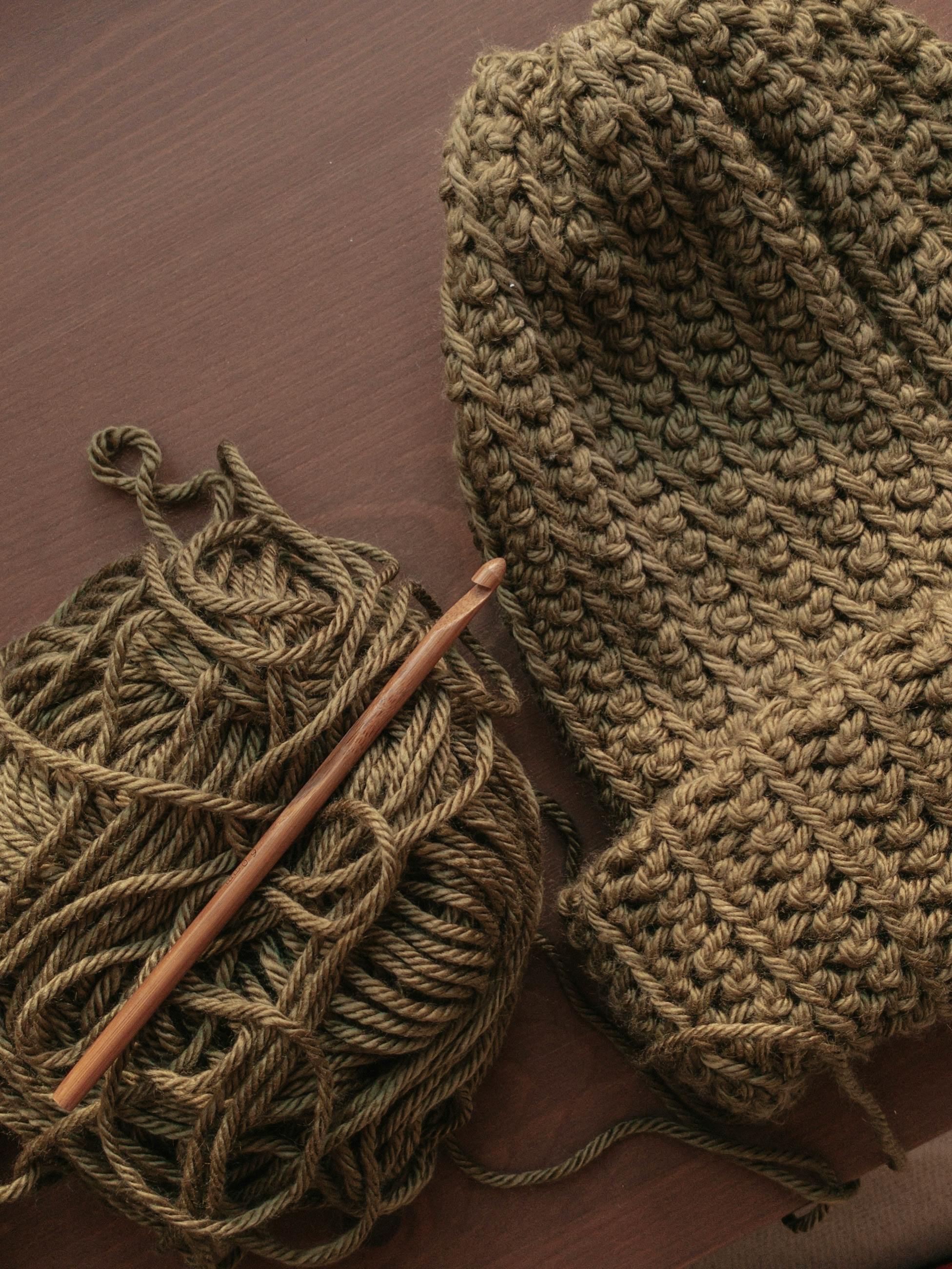 Cozy crocheted scarf draped over a table, showcasing a perfect beginner project.