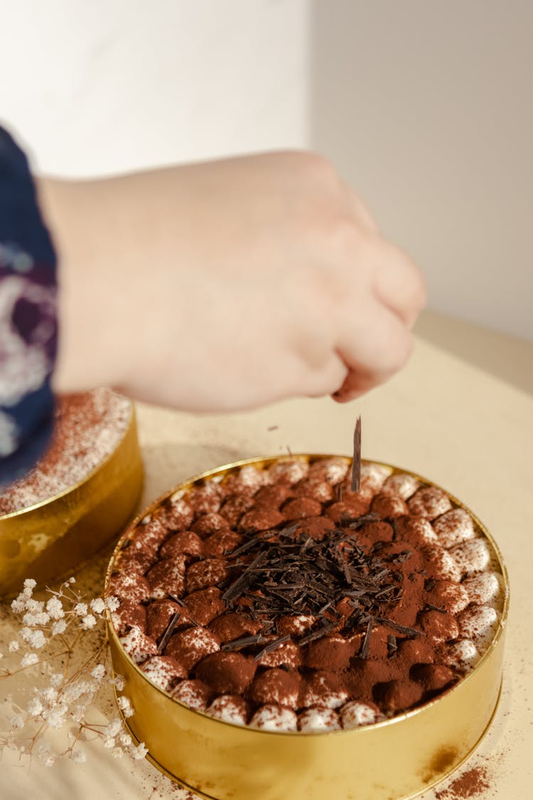 Hand Decorating Cake With Chocolate