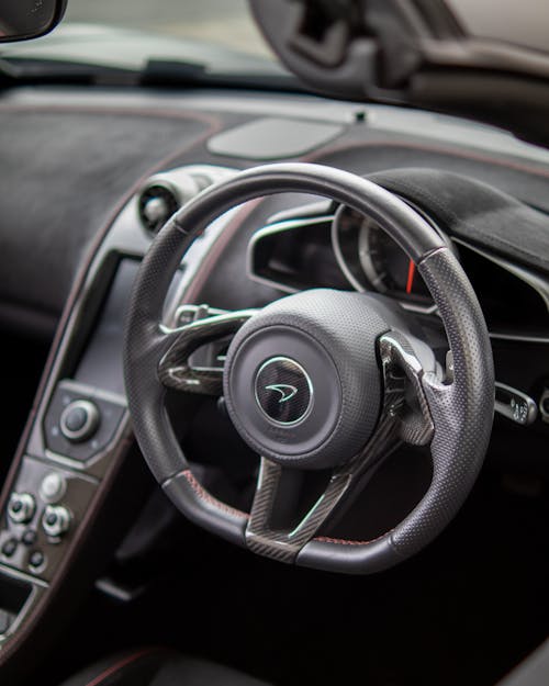 Free Black Steering Wheel of a Car Stock Photo