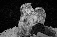 Grayscale Photo of Angel Statue