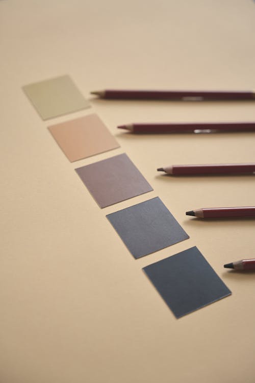 Free Blue and Brown Pencil on White Table Stock Photo