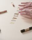 Person Writing on White Paper