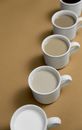 White Ceramic Mug on Brown Wooden Table