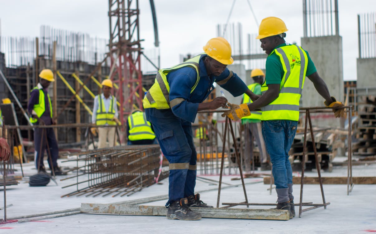 Free Construction Workers on the Building Site Stock Photo