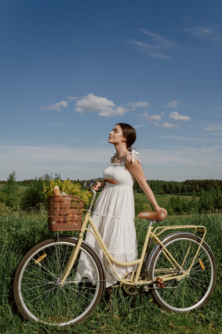 Woman Among Nature With Bicycle