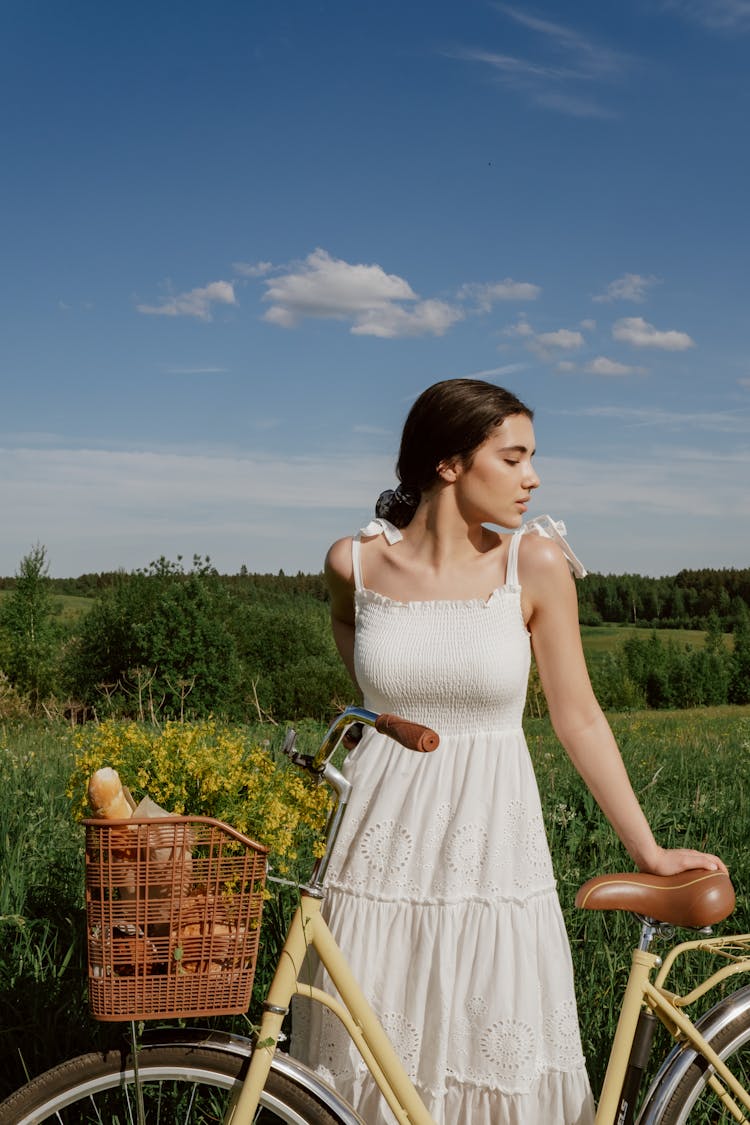 Woman In Dress With Bicycle