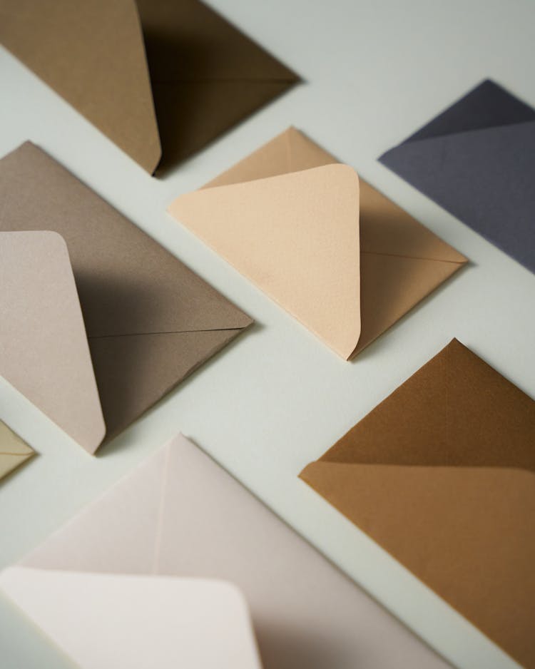 Brown Envelopes On White Surface