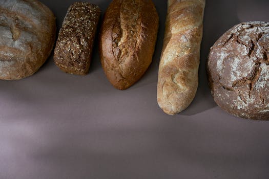 A selection of freshly baked artisan breads showcasing various textures and grains.
