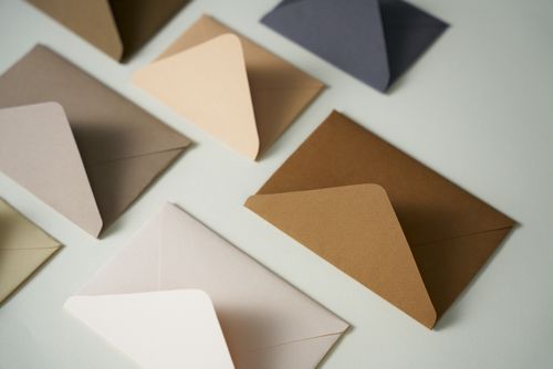 Free A flat lay arrangement of various colored envelopes in a minimalist style, offering diverse stationery options. Stock Photo