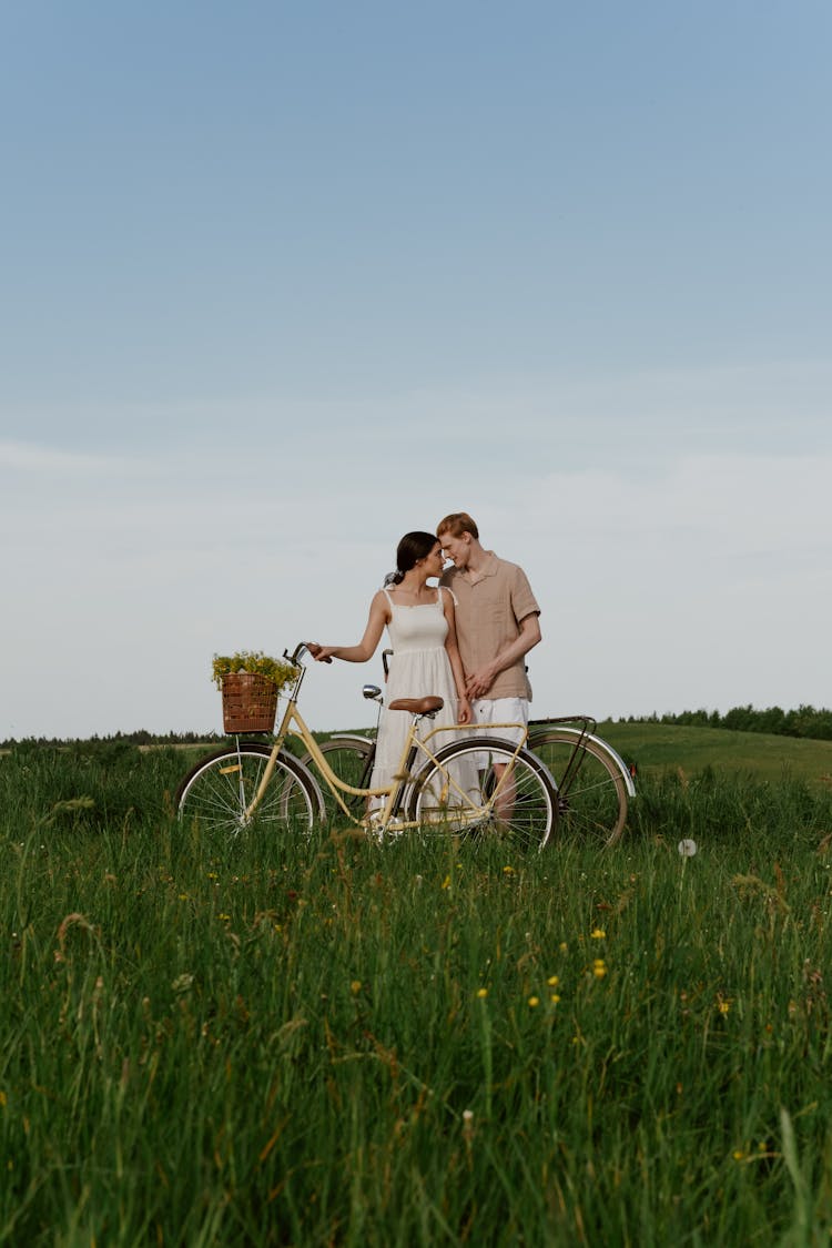 A Couple On A Grass Field 