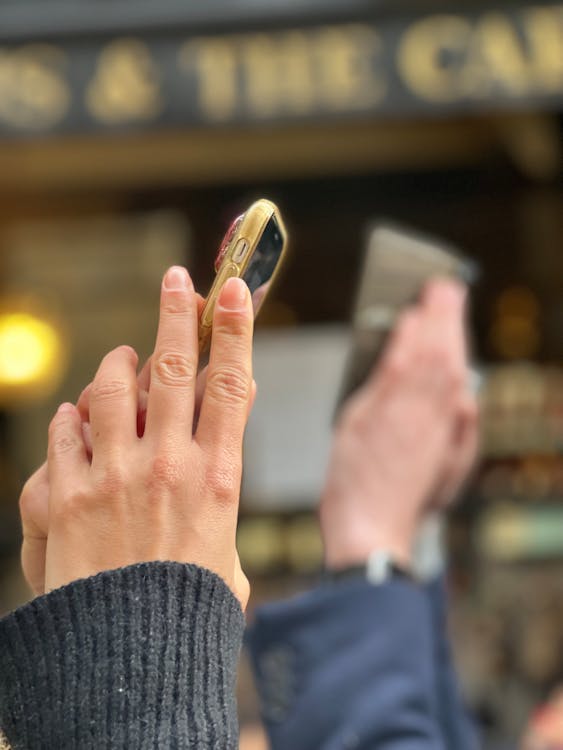 Hands Holding a Smart Phone