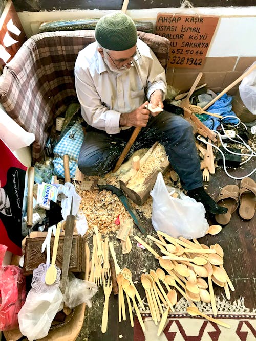 Man Selling Handmade Wooden Cutlery 