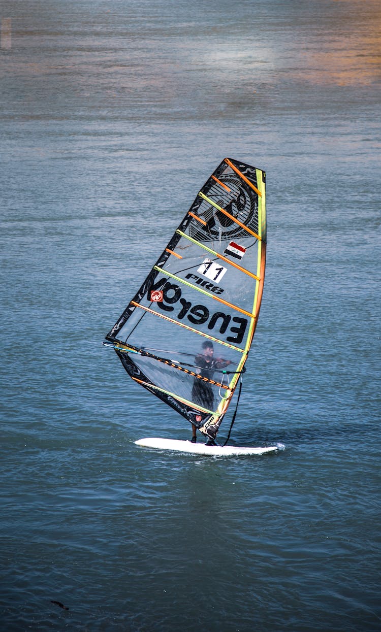 Man Windsurfing On Lake 