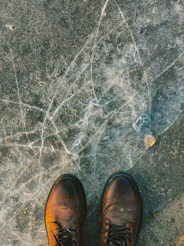 Top View Of Shoes On The Concrete 