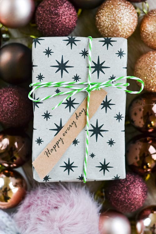 Free Black and Gray Box Beside Glittery Christmas Balls  Stock Photo