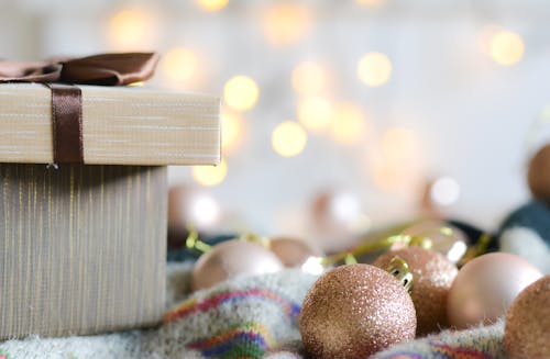 Beige Christmas Balls on Textile Near a Box