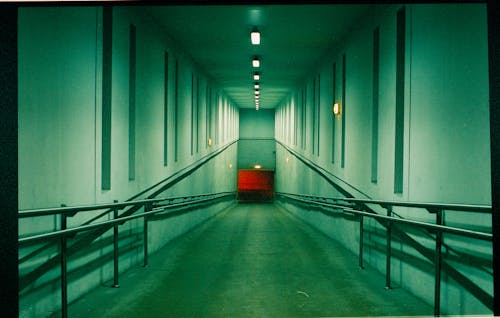 Empty Ramp with Metal Railings in a Building