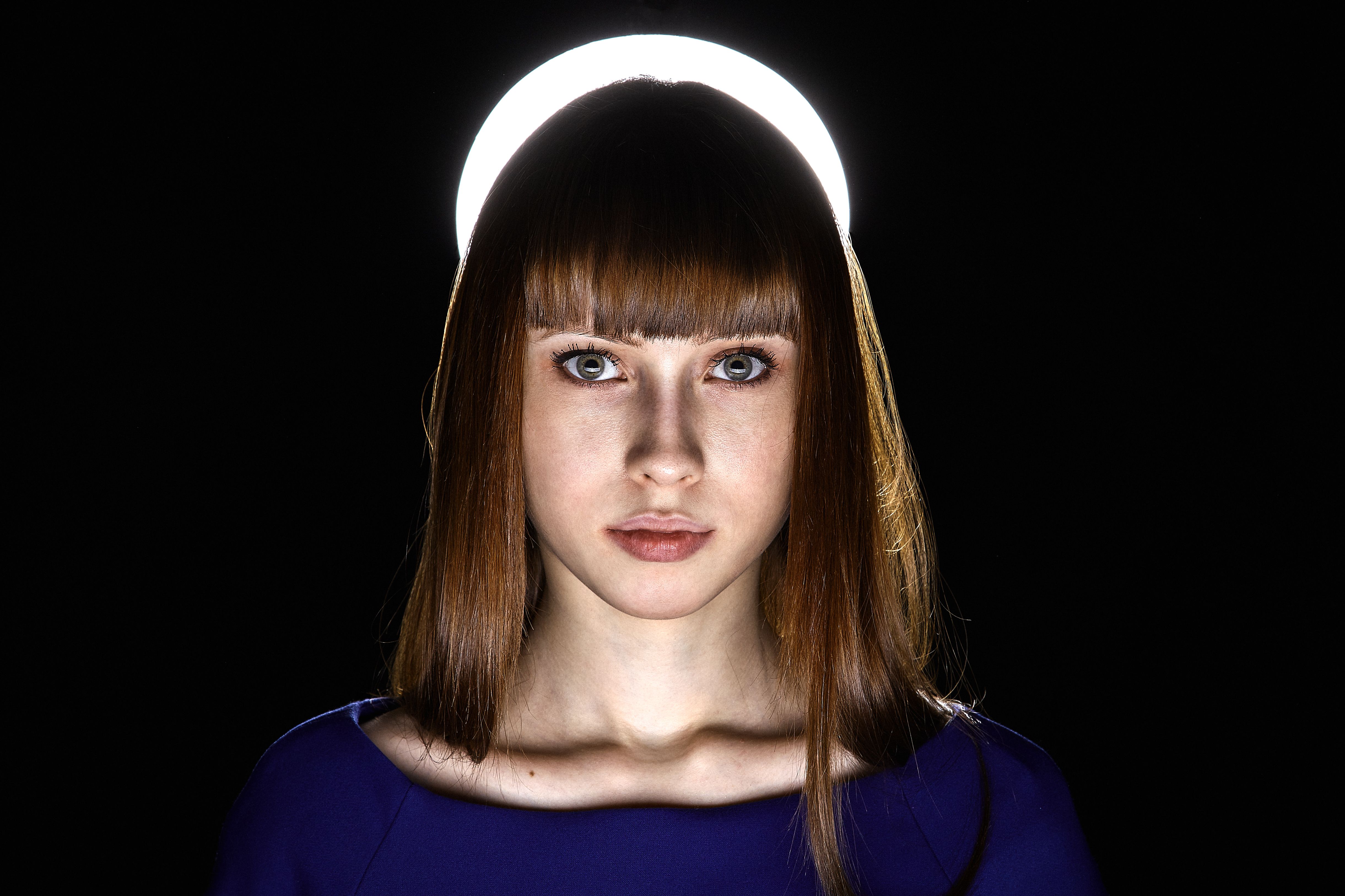 Artistic portrait of woman with halo-like lighting backdrop, expressive eyes.. pexels, artistic, portrait