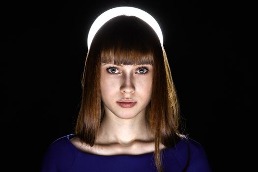 Artistic portrait of woman with halo-like lighting backdrop, expressive eyes.. pexels, artistic, portrait