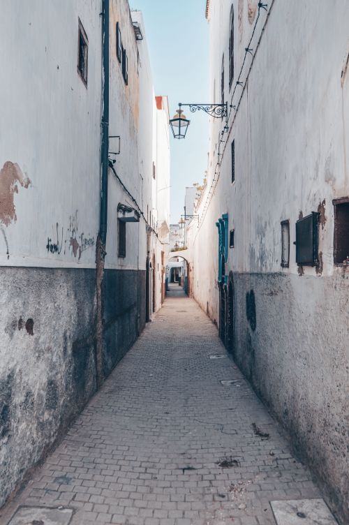 Free Charming narrow alleyway in the historic medina of Rabat, Morocco, showcasing traditional architecture. Stock Photo