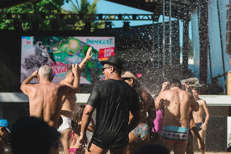 People Cooling Off In The Fountain