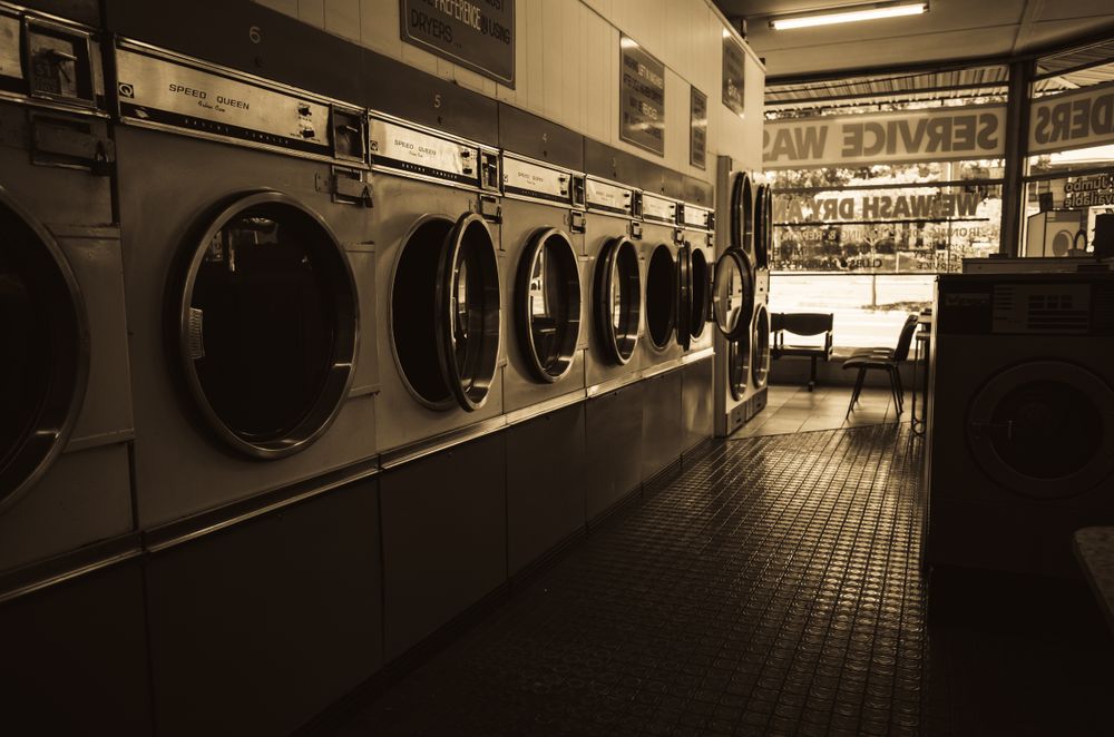 A laundromat interior with washing machines