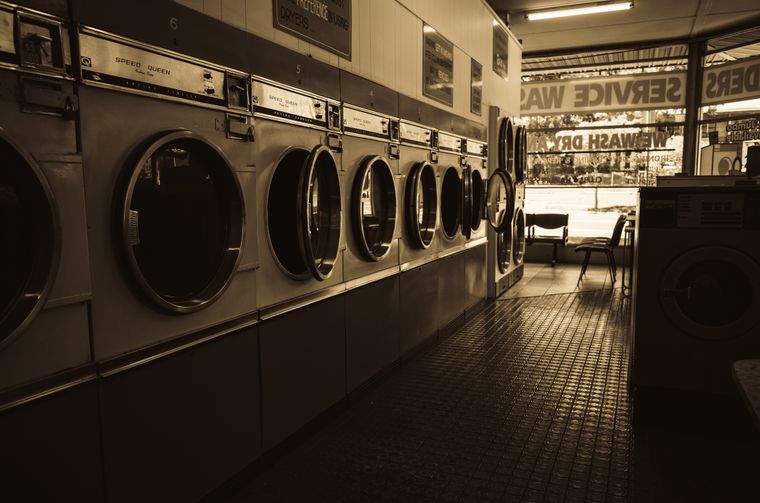 Row of dryers in a laundromat