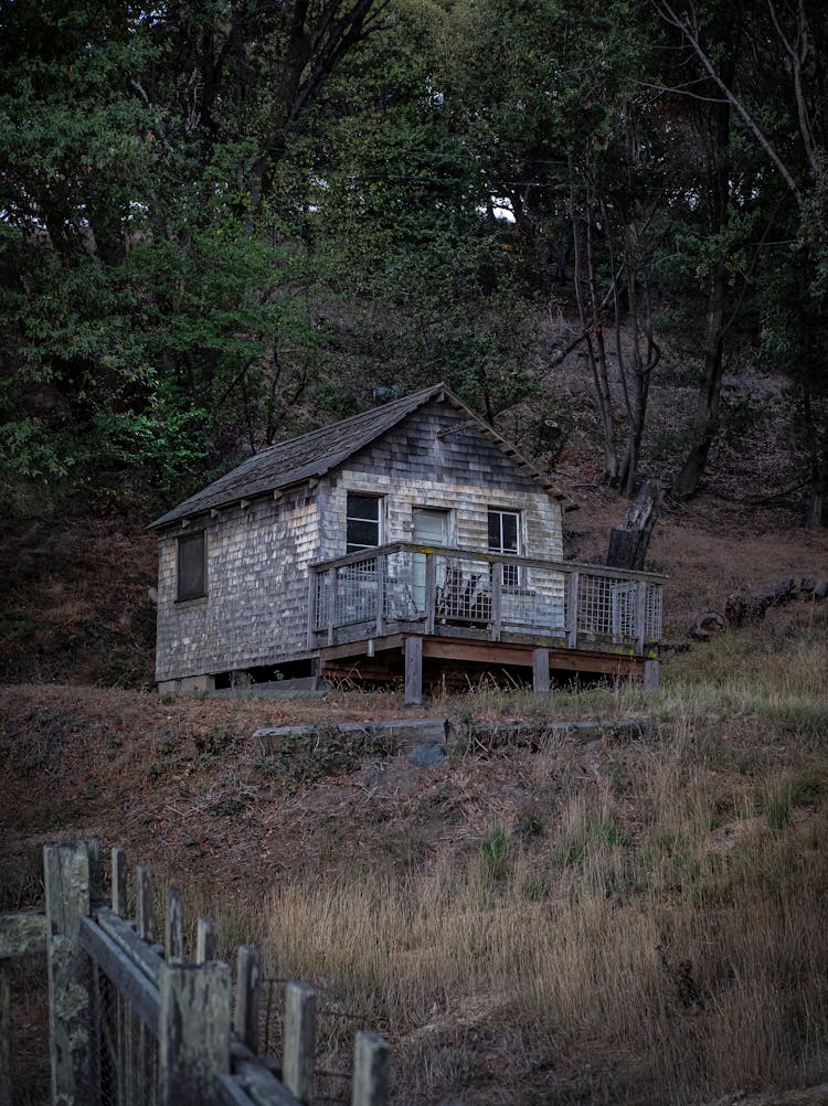 Abandoned House On Hill In Forest