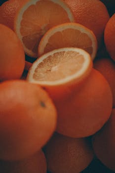 Close-up of freshly sliced oranges with a warm, rustic ambiance.
