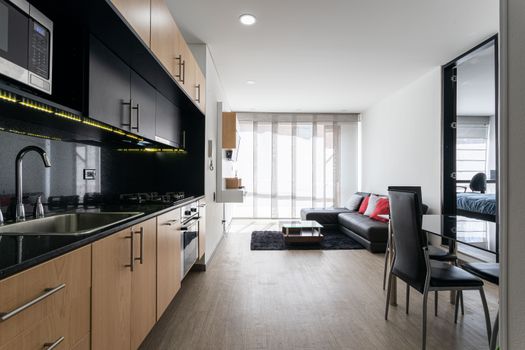 Contemporary open-plan kitchen and living area in Bogotá, Colombia.