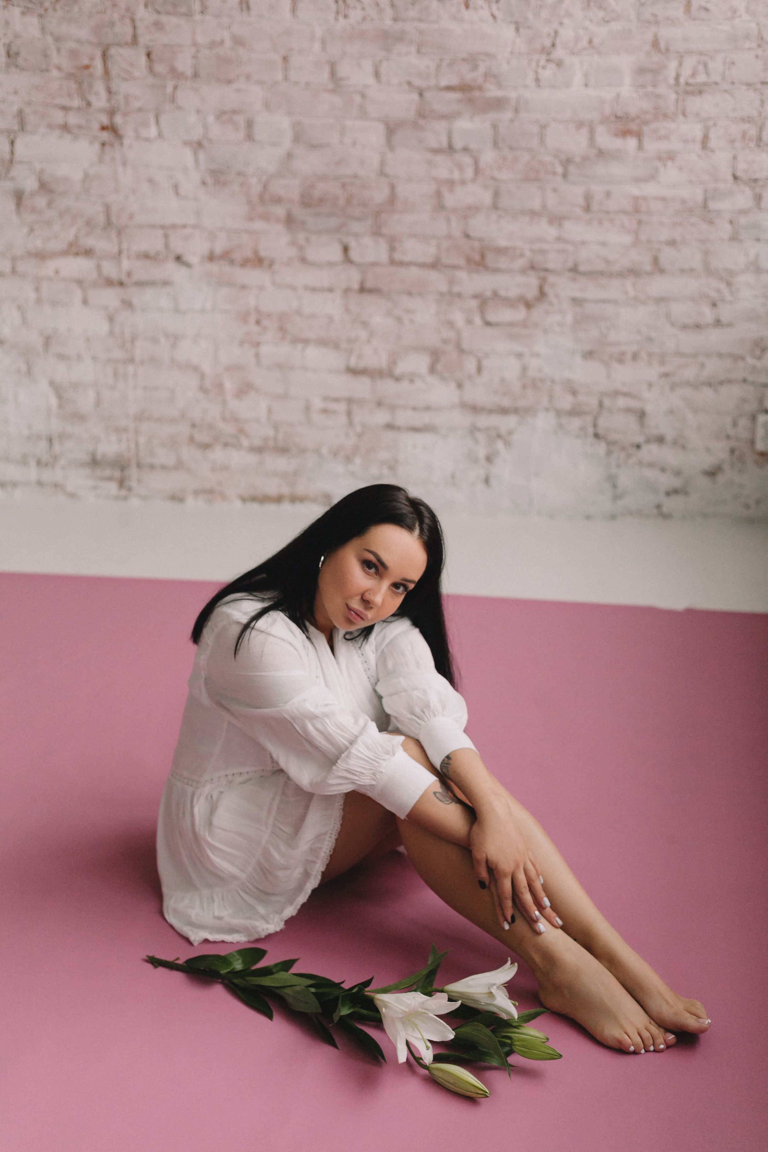 Girl in White Dress Sitting on the Pink Floor · Free Stock Photo