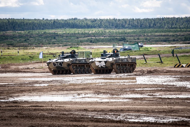 Military Tanks On A Muddy Field